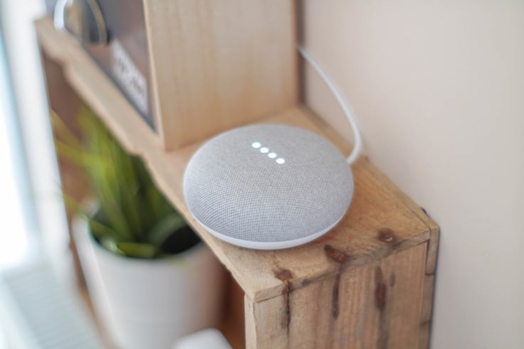 Google Home voice assistant placed on a shelf