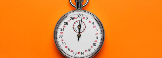 Vintage timer on orange background, top view
