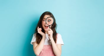 a girl with a reading glass