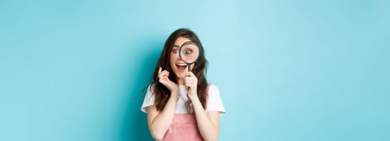 a girl with a reading glass