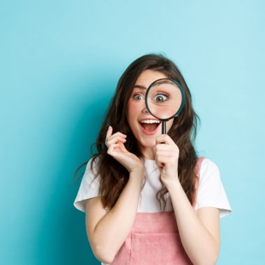 a girl with a reading glass