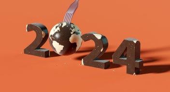 Year 2024 on orange background with world