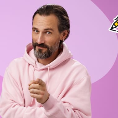 the man in a pink sweatshirt pointing at you