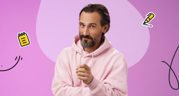 the man in a pink sweatshirt pointing at you