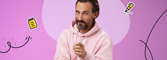 the man in a pink sweatshirt pointing at you