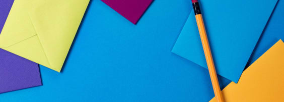 papers on blue table with pencil