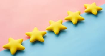 Five stars on pink-blue background